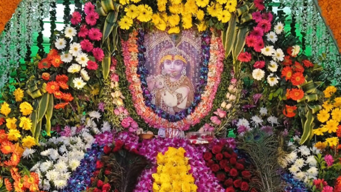 Baba Shyam's decorated bungalow tableau with 56 offerings and flowers