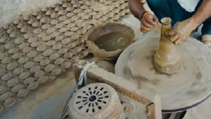 Potters are giving shape to clay lamps using electronic wheel