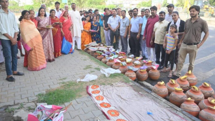 Hand fans along with 211 pots were distributed to needy families