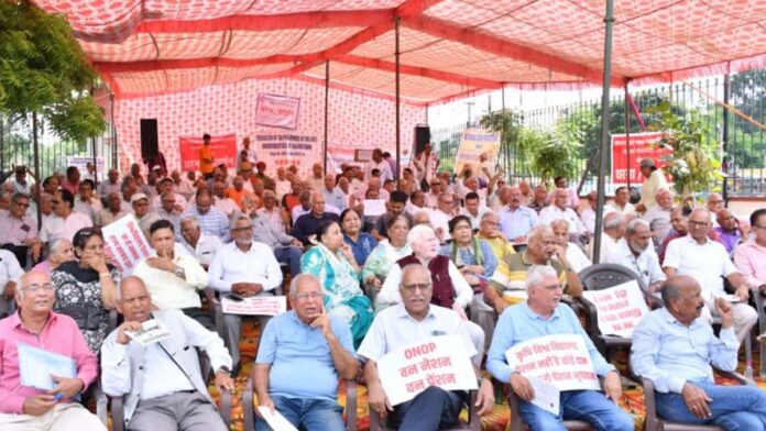 Teachers and employees associated with government universities staged a dharna at Shahid Smarak