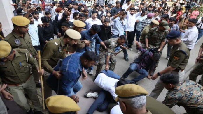 Students protest against the increase in revaluation fees.