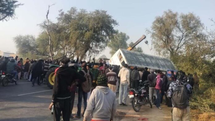 The bus overturned after losing control while trying to avoid hitting a motorcycle.