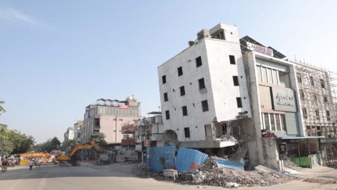 The five-story leaning building was demolished by the JDA.