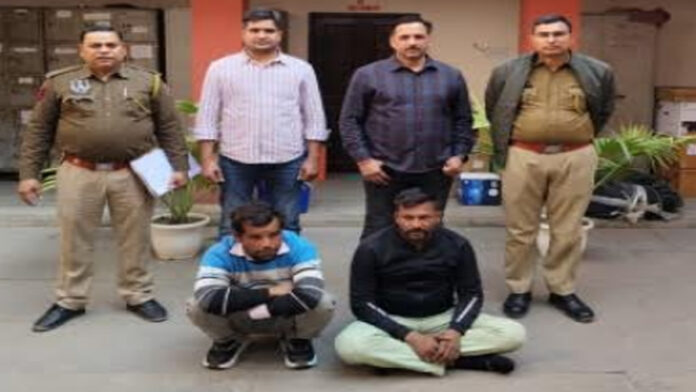 Two suspects arrested for mobile phone and cash robbery.