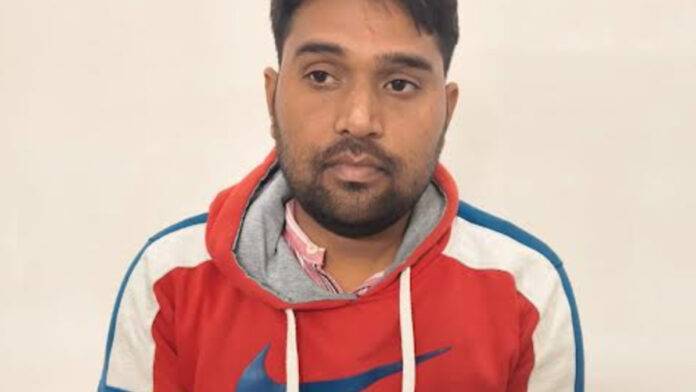 A land record officer was caught red-handed accepting a bribe for processing a mutation request.