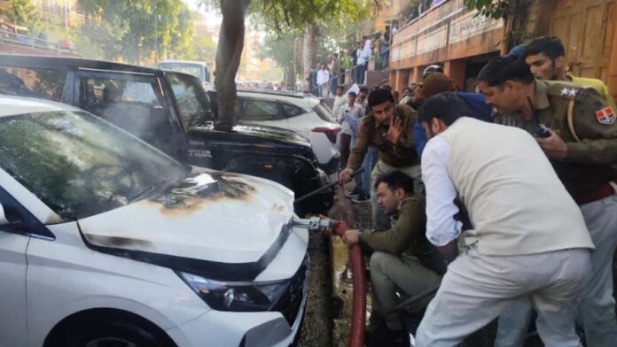 A car parked in the parking lot caught fire.