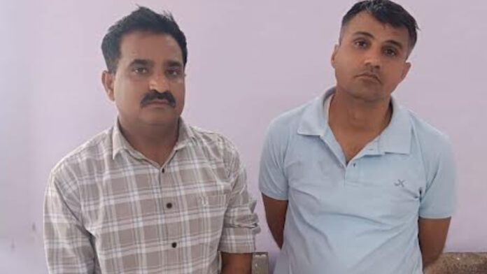 Two police personnel, including the Station House Officer, arrested for accepting a bribe of ₹8 lakh.
