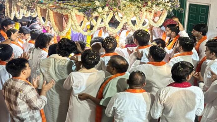Prem Bhaiya sets out on a town procession during the Nagar Sankirtan.