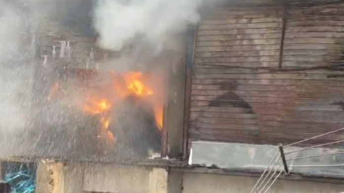 Massive fire breaks out at tire warehouse.