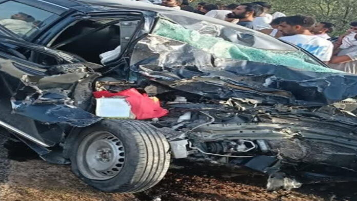 Two killed in car-trailer collision.