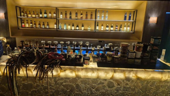 Illegal Hookah Bar Operating at Club: Police Raid and Arrest Manager