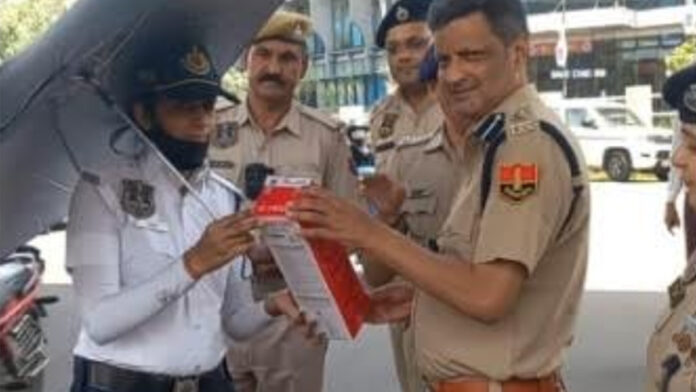 Umbrellas and Water Bottles Distributed to Traffic Wardens Umbrellas and Water Bottles Distributed to Traffic Wardens