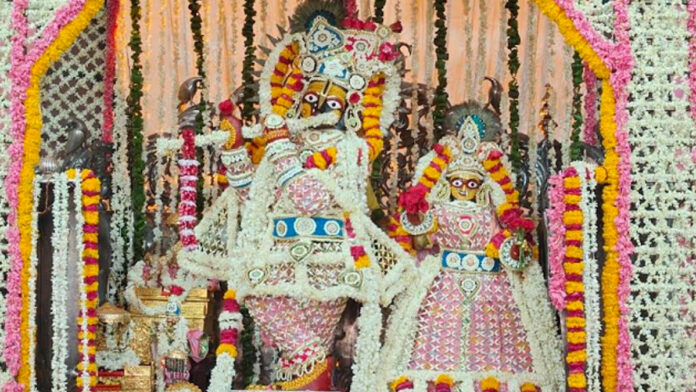 A canopy made of handmade flowers adorns the Govind Dev Ji Temple. A canopy made of handmade flowers adorns the Govind Dev Ji Temple.