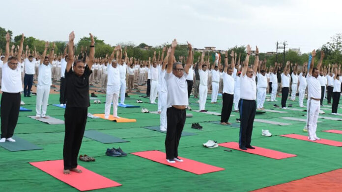 Over 1,100 police personnel performed a mass yoga session led by DGP Rajiv Kumar Sharma. Over 1,100 police personnel performed a mass yoga session led by DGP Rajiv Kumar Sharma.
