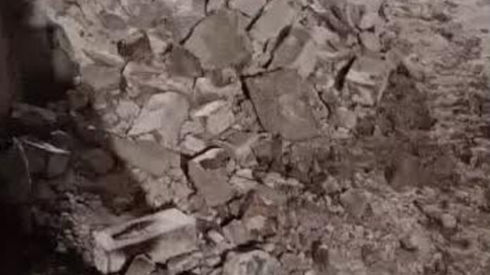 Woman dies after balcony of dilapidated mansion collapses.