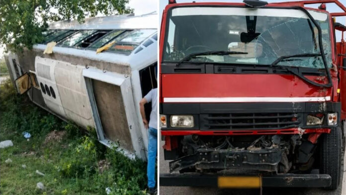 A trailer truck rear-ended a bus that was parked on the roadside due to a breakdown.