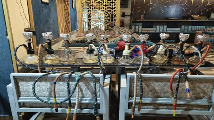 Police raid illegal hookah bar. Police raid illegal hookah bar.