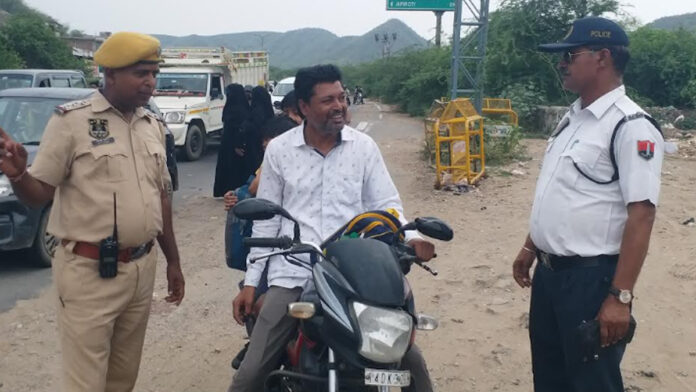 Police crack down on riders without helmets. Police crack down on riders without helmets.