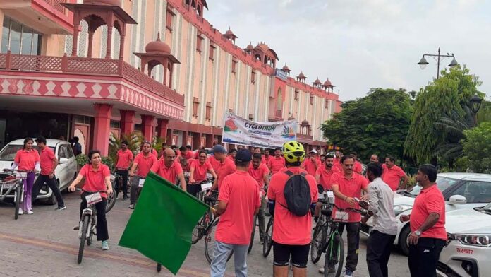 Officials conveyed a message of fitness by cycling. Officials conveyed a message of fitness by cycling.