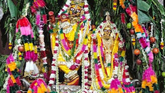 Thakur-ji adorned with sacred garlands scented with saffron and agarwood.