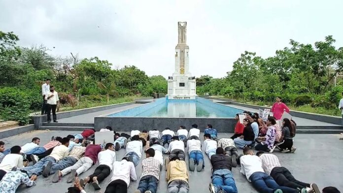 Students stage a prostrate protest demanding student union elections. Students stage a prostrate protest demanding student union elections.