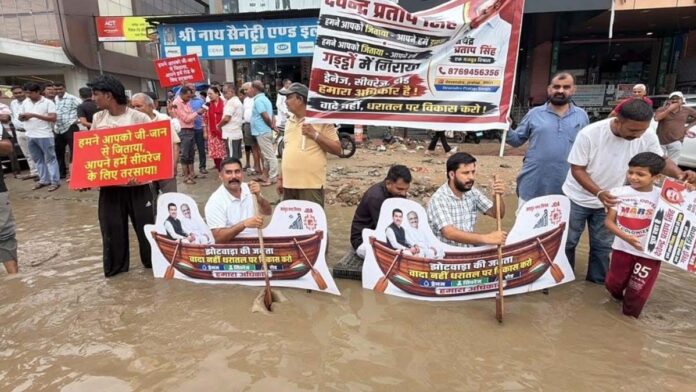 Sit-in protest in three feet of water: Symbolic boat rowed on the road. Sit-in protest in three feet of water: Symbolic boat rowed on the road.