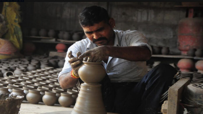 kumm Clay *karvas* taking shape on the potter's wheel